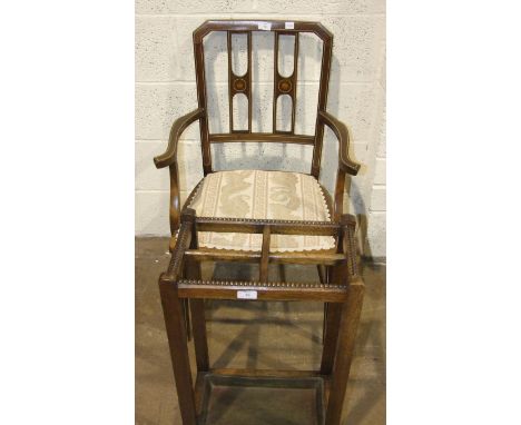 An Edwardian inlaid armchair with padded seat, on tapering front legs and an oak four-division stick stand, (2).