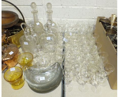 A collection of cut glass and other glassware, including a ship's decanter, five other decanters, a part-suite of drinking gl