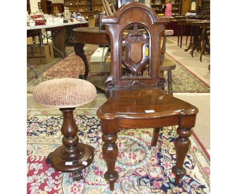 A Victorian mahogany hall chair, with pierced shield back on octagonal shaped front legs and a mahogany revolving piano stool