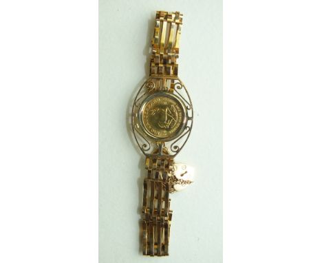 A 1/10 Krugerrand 1980 in a 9ct gold gate-link bracelet, 11.8g.