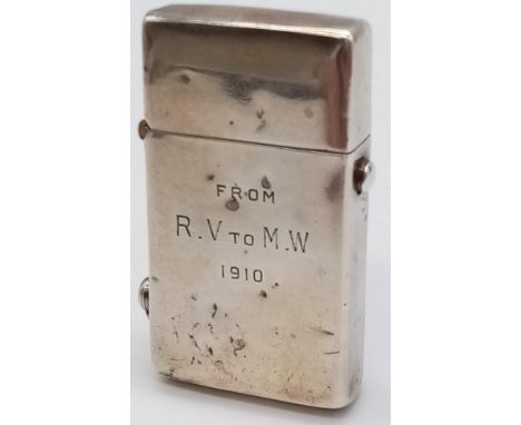 An antique hallmarked solid silver pushup lighter. 70.8 grams. 