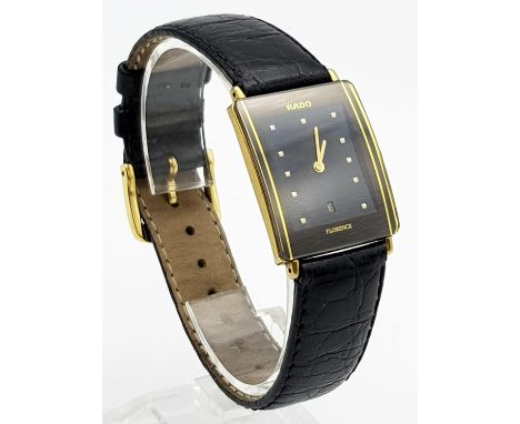 A Rado Florence Ladies Watch. Black leather strap with two-tone case - 30 x 22mm. Black dial with date window. Quartz movemen