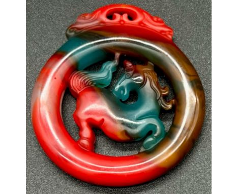 A Multi-Coloured Jade Circular Year of the Horse Pendant. 4.5cm diameter. 