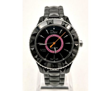 A Christian Dior VIII Automatic Ladies Watch. Black ceramic bracelet and case - 35mm. Black dial with a circle of purple rubi