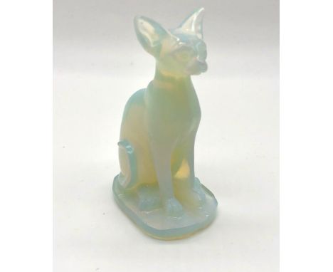 A Fire Opalite Carved Cat Figure. Lovely orange glow when refracting light. Perfect for an ornament or small paperweight. 8cm