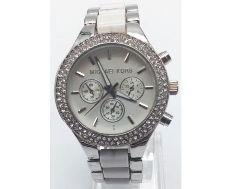 A Michael Kors Ladies Dress Chronograph Watch. White enamel and steel strap. Case - 38mm. White dial with three sub dials. Qu