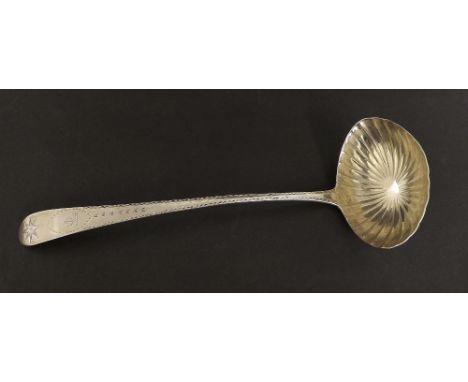 Irish silver bright cut soup ladle, engraved with a crest of a fist holding a thistle and faceted bowl, maker JS, Dublin and 