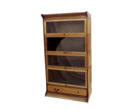 Globe Wernicke four tier sectional bookcase with a drawer at the bottom, 62" high, 34" wide (at fault)