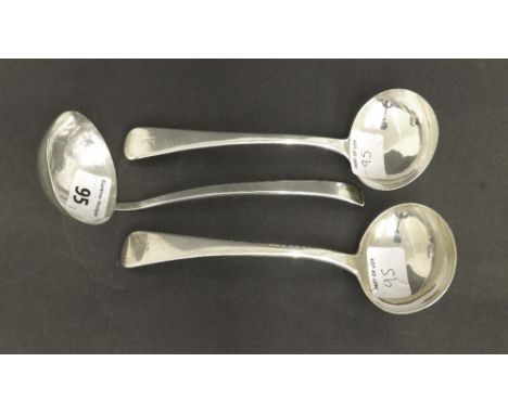 Two similar late George IV silver sauce ladles, maker RC and WT, London 1825 and 1831, 7" long; together with modernist silve