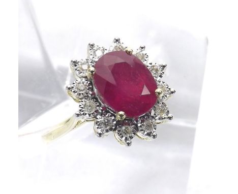 Ruby and diamond oval cluster ring, the oval ruby in a surround of twelve round brilliant-cut diamonds, 9ct, cluster 15mm, ri