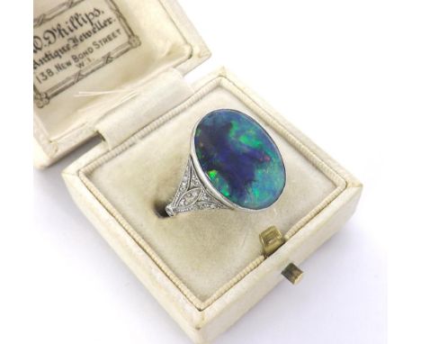 Rare Art Deco solid black opal and diamond set platinum ring, the central opal estimated 5.20ct approx (measuring 18mm length