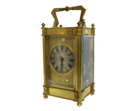 Carriage clock striking on a gong, the 1.5" circular silvered dial within a gilt mask and brass case, 6.25" high