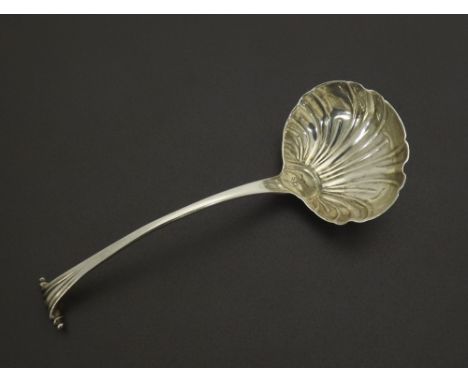 18th century 'Onslow' pattern silver ladle, maker George Baskerville, fluted shell bowl with engraved crest, 6.25" long, 1.5o