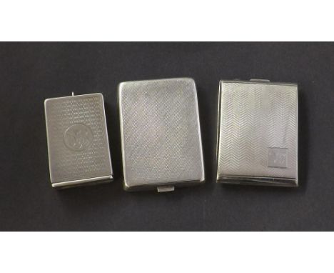 Three silver engine turned vesta cases, each with hinged lid, 4oz approx (3)