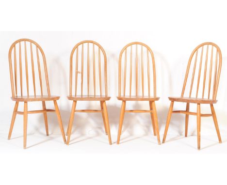 A group of four retro vintage mid 20th century teak hoop back dining chairs in an Ercol manner / Windsor style. Having a curv