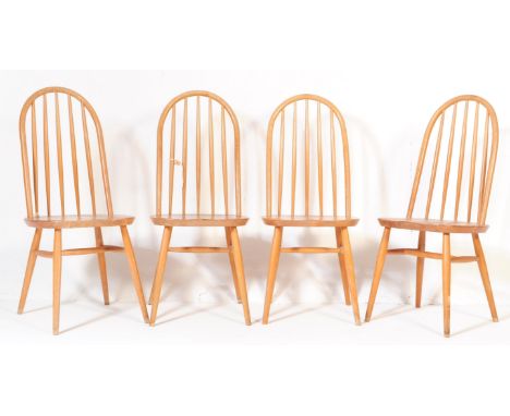 A group of four retro vintage mid 20th century teak hoop back dining chairs in an Ercol manner / Windsor style. Having a curv