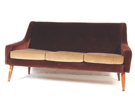 A retro vintage mid 20th century brown 3 person velvet sofa settee daybed. With a rectangular flat cushioned backrest curved 