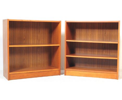 Two retro, vintage mid 20th century teak open faced bookcases. Each bookcase having two open shelves raised on a plinth base.