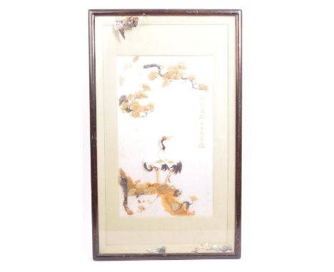 A large 20th century Japanese specimen stone shibayama picture. Depicts cranes standing on outcrop with tree above constructe