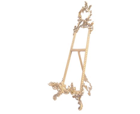 Early 20th century gilt metal easel stand of Art Nouveau form for paintings. Gilt metal rococo scroll work with an adjustable