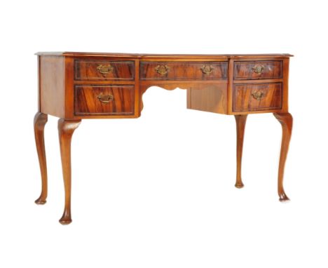 A vintage, retro, mid century walnut Queen Anne revival / style&nbsp;lowboy desk. Raised on cabriole legs with pad feet havin