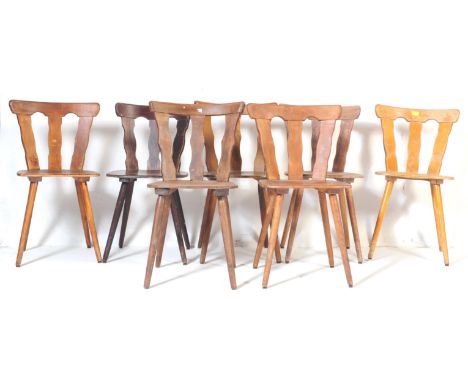 A collection of seven retro vintage mid 20th century circa 1950s teak bistro kitchen dining chairs. Having a horizontal slat 