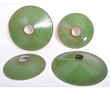 Set of four mid 20th Century vintage industrial enamel factory lamp shades different sizes.&nbsp;Space Age UFO form in green 