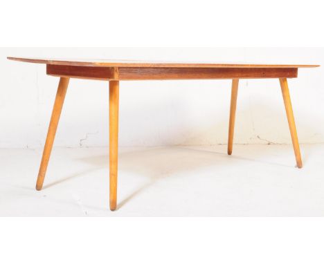 A retro vintage mid 20th century teak long john coffee table. Of rectangular form, raised on four tapered wooden supports. Me