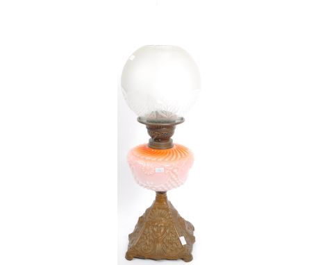 An early 19th century, late Victorian cast metal and floral decorated opaline glass oil lamp by Duplex. The reservoir having 