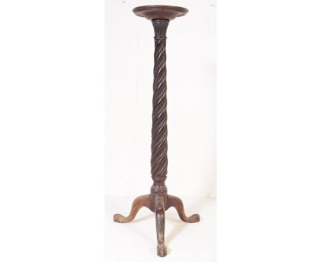 A Victorian 19th century mahogany torchere plant stand - jardiniere. The stand with circular top, turned twisted column raise