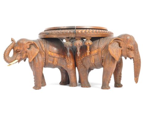 20th century unusual carved hardwood Chinese socle plinth vase stand. Raised on a trio of elephants with circular base atop w