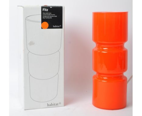 Habitat - A contemporary Habitat Fitz cased glass table lamp in a red / orange colourway of cylindrical form. Measures approx