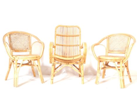 A set of three retro, vintage mid 20th Century wicker bamboo conservatory hall chairs. Having a curved back with square seat 