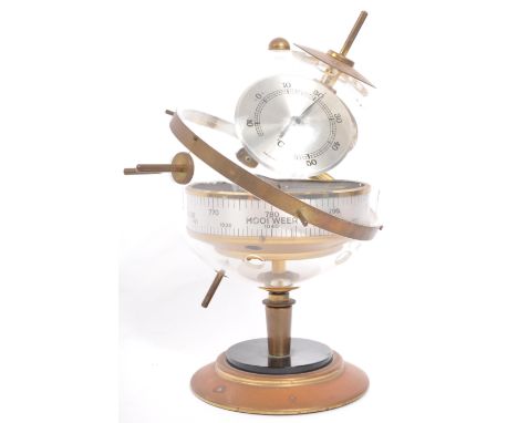 A mid 20th century circa. 1960's West German sputnik globe barometer set within a gilt metal frame on circular base.&nbsp;