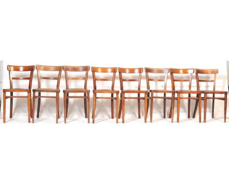 A set of eight retro vintage 20th century wooden dining chairs by STOE / BEN. Each chair having a single rail back support ov