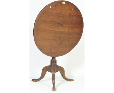 A 19th century Victorian mahogany tilt top loo / occasional table having a rounded edge, circular table top with turned and s