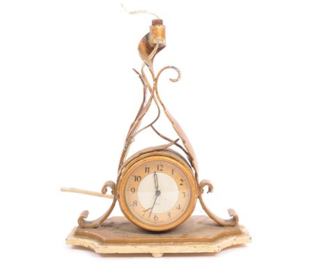 Smiths - A 20th century vintage circa. 1940's gilt metal mantel clock having silvered face with gilt dial with black Arabic n