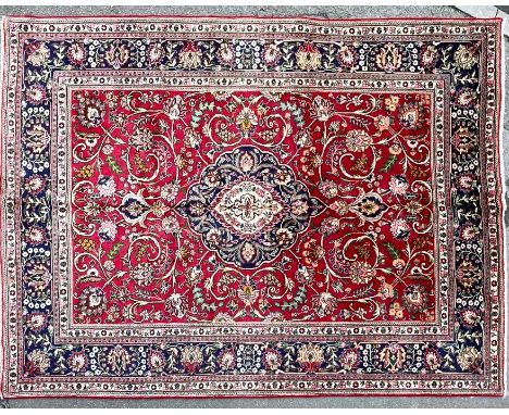 A vintage 20th Century north west Persian Tabriz carpet floor rug. Having a central panel with polychrome foliate decorations
