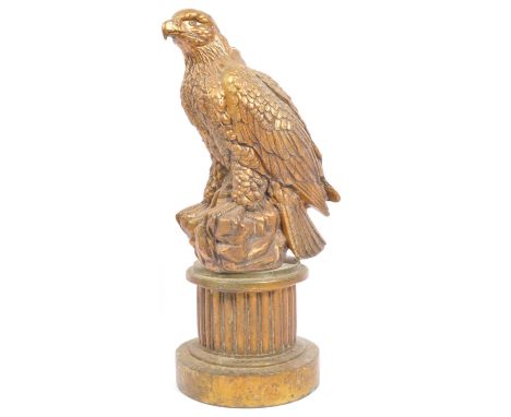 An early 20th century gilt metal federal style lamp base in the form of an eagle sat atop a reeded column. Measures 42cm tall
