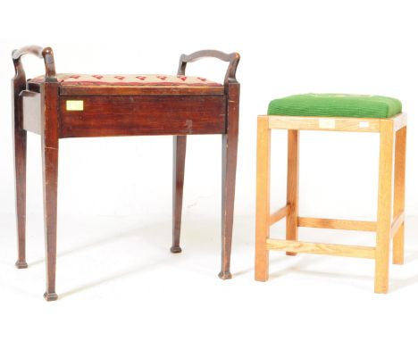 An Edwardian early 20th century mahogany twin handled piano stool. The stool having turned twin handles to sides over a fabri