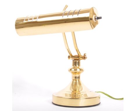 A retro vintage 20th Century brass bankers, office / desk / bankers lamp light. With adjustable vented shade, supported on tw