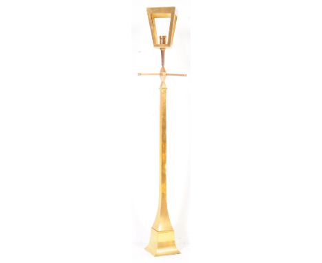 A 20th century brass upright floor standing standard lamp in the form of a Victorian street light having a gilt brass effect 