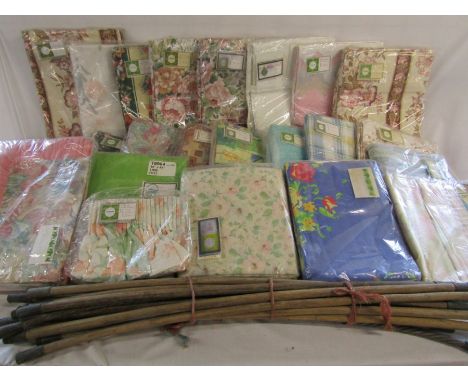 Large collection of curtains and a couple of duvet covers also a set of drain rods