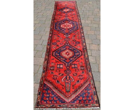 Red ground Persian Hamadan runner with medallion design 360cm by 76cm&nbsp;