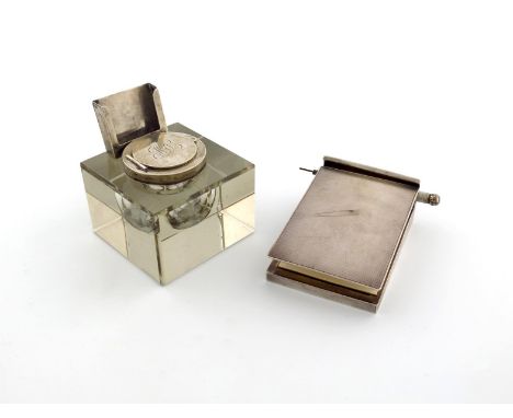 A silver notepad and pencil, by Asprey and Co, London 1924, rectangular form, engine-turned decoration, the sprung hinged cov