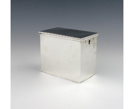 A George III silver tea caddy, by John Swift, London 1763, rectangular form, the hinged cover engraved with an armorial withi