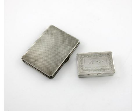 A silver cigarette case, Chester 1928, rectangular form, engine-turned decoration, the interior with an engine-turned cover w