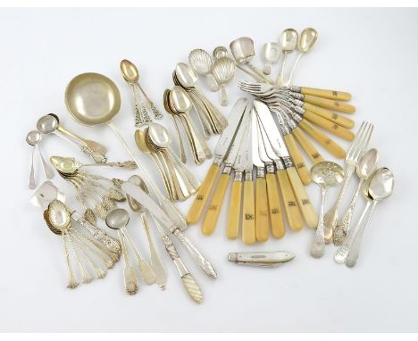 λ A mixed lot of silver flatware, various dates and makers, comprising: a soup ladle, with English import marks for 1910, fou