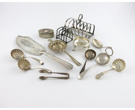 A mixed lot of silver items, various dates and makers, comprising: a George III fish slice, London 1800, two toast racks, a c