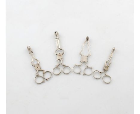 A small collection of four pairs of 18th century silver sugar nips, comprising: an Irish pair, Dublin, and three London pairs